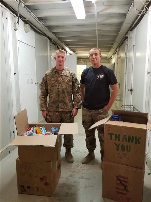 Theo D. and Ryan K with OEG care packages 