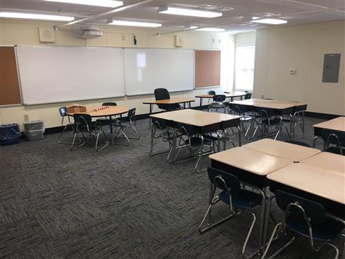 Finished butler modular classroom with desks and white boards 
