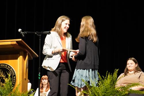 Student recieving award on stage