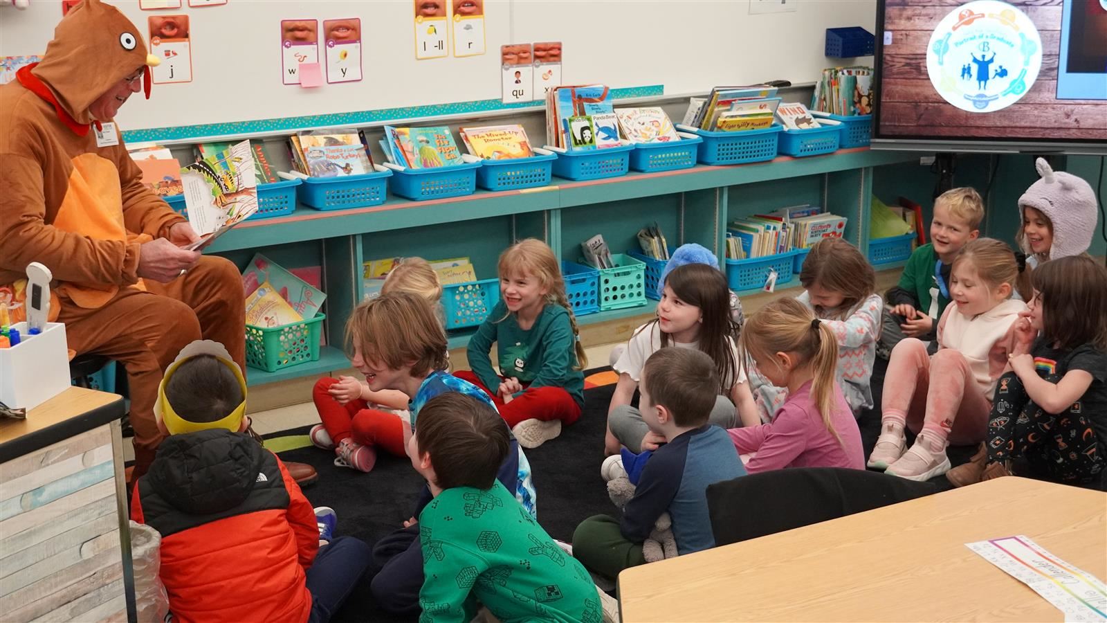 A special guest dressed as a turkey reads to students.